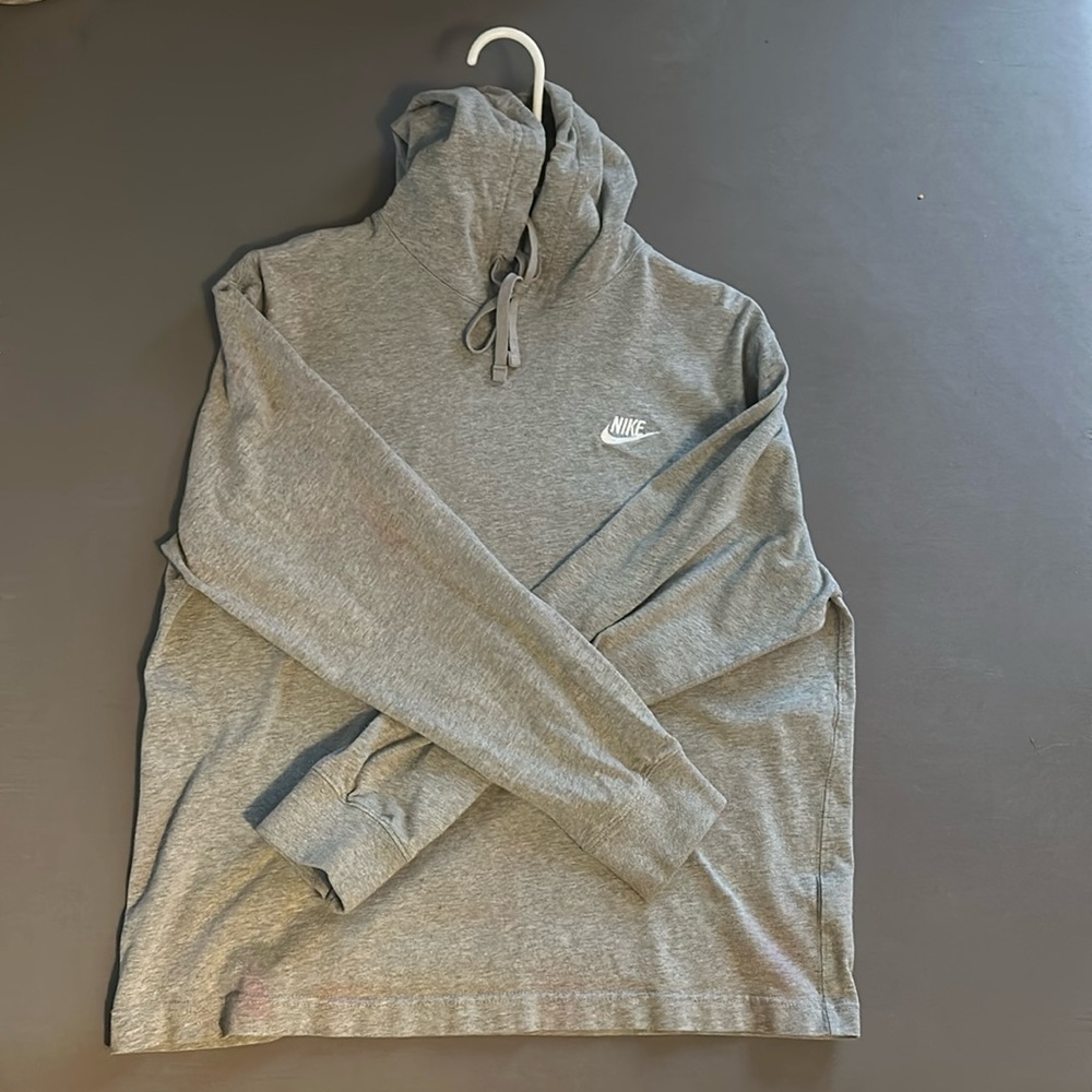 Grey Nike sweatshirt, has two ,small noticeable pink spots on sleeve and bottom